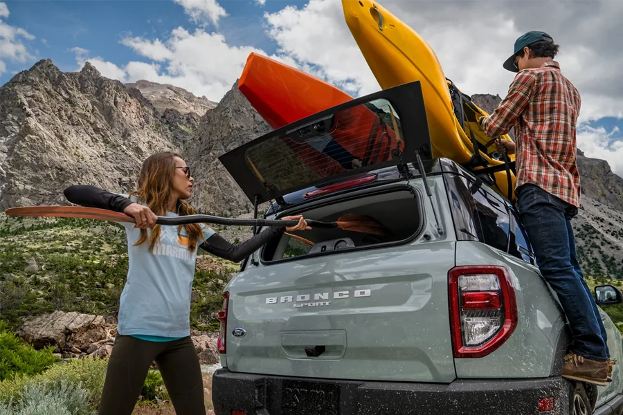 Unloading kayak form Bronco Sport Why Buy At Acton Ford