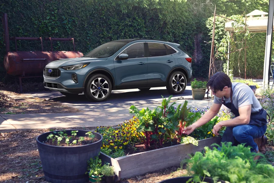 Ford Deals and Finance Offers Man Gardening In front of Ford Escape