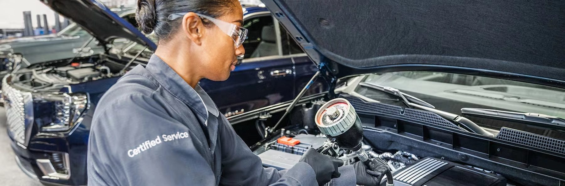 GMC Service tech working on a car