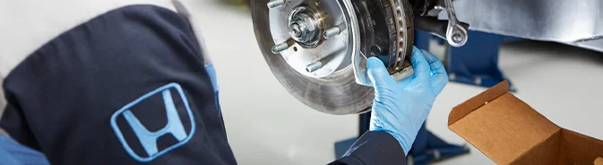 Honda Service Tech working on a car