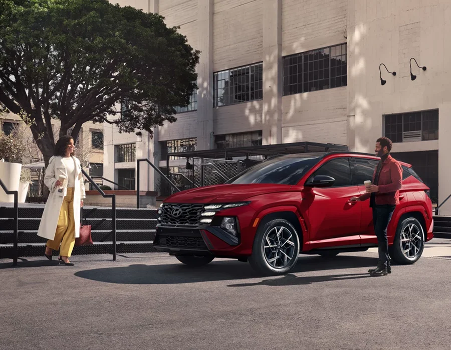Two People getting into a Hyundai Tucson
