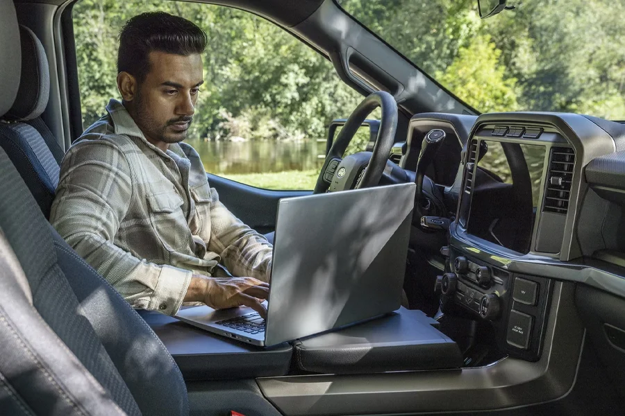 2025 Ford F-150 Features Man Using Laptop Inside F-150