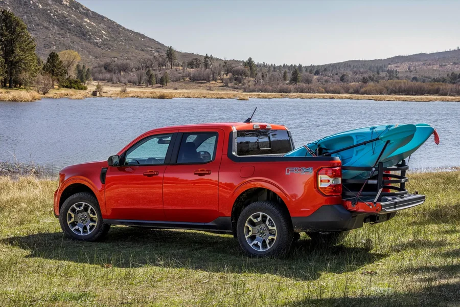 Why Buy At Mathieu Ford Ford Maverick with a kayak in the bed near a lake