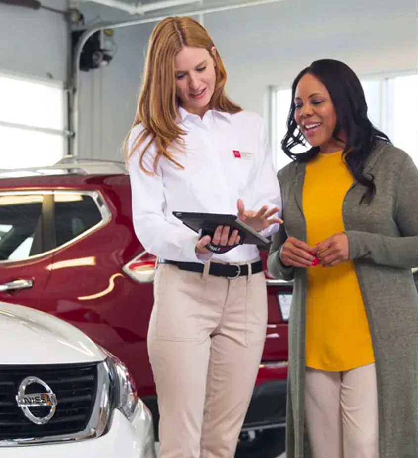 Coastal Nissan - Nissan Employee Helping Customer