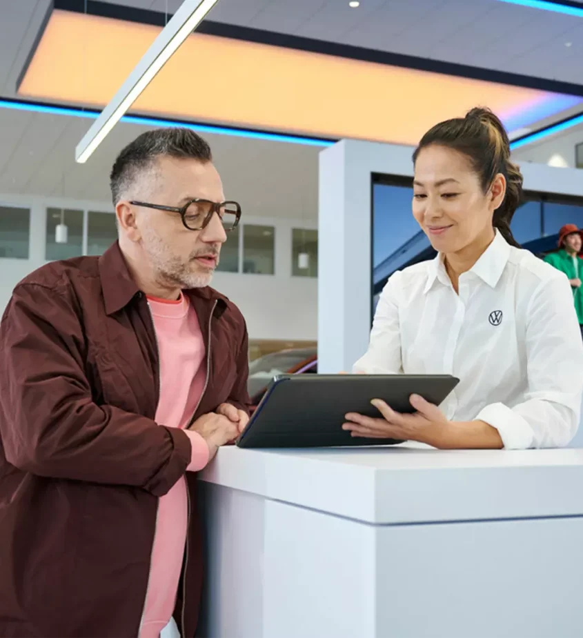 Coastal VW - Volkswagen Employee Helping Customer