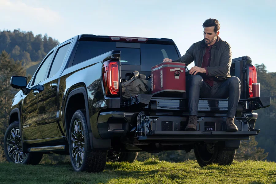 Man Sitting in Bed of 2026 GMC Sierra
