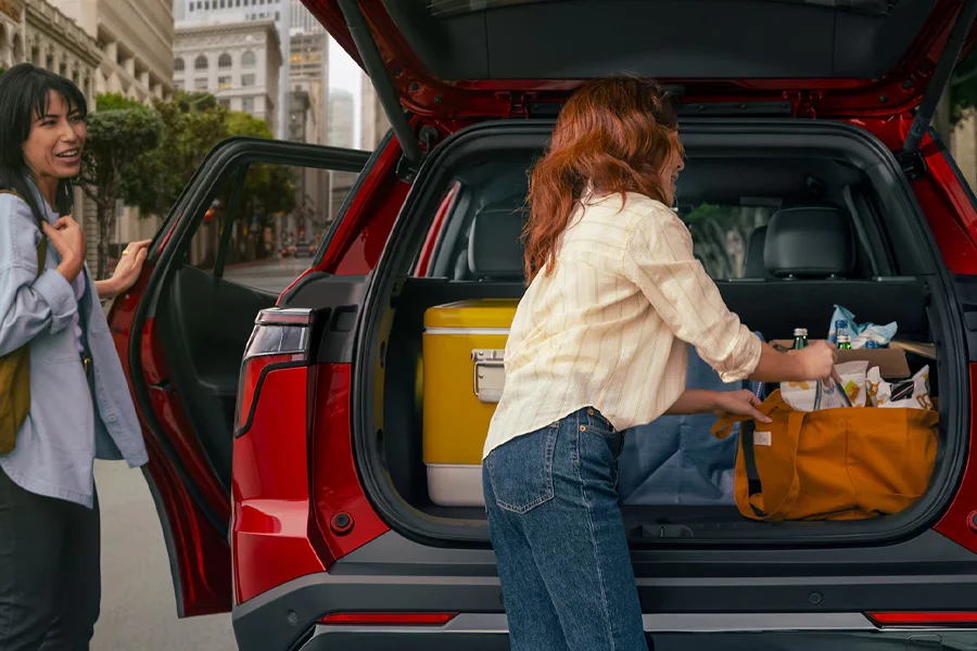 two women loading the trunk of a 2026 Chevy Equinox