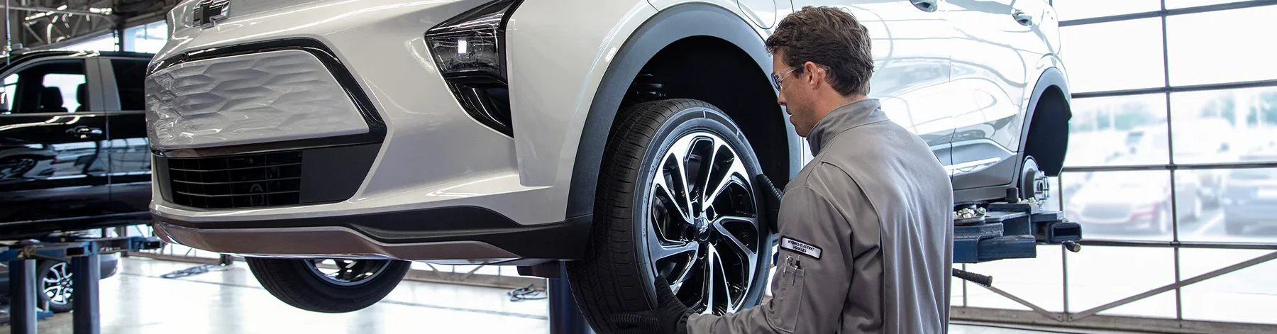 Chevy Service tech changing tire