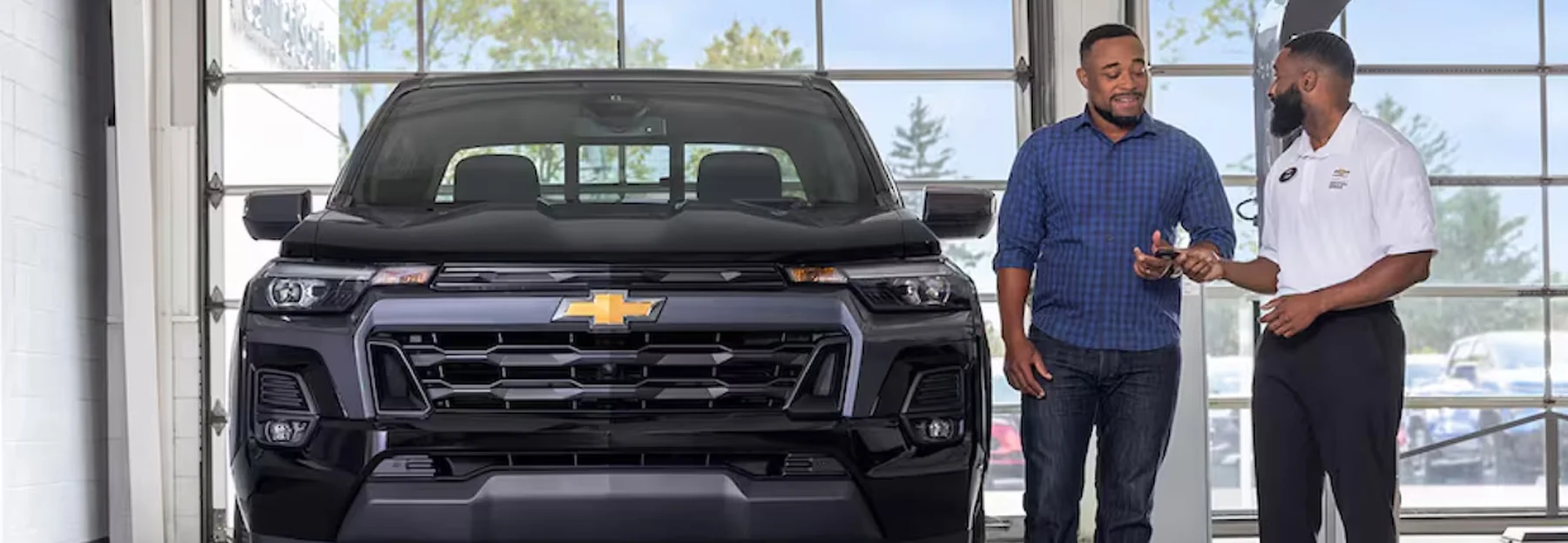 Chevy Service tech handing keys to an owner