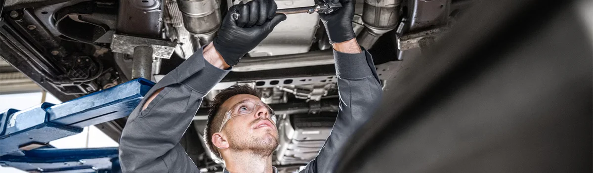 GMC Service tech working on a car