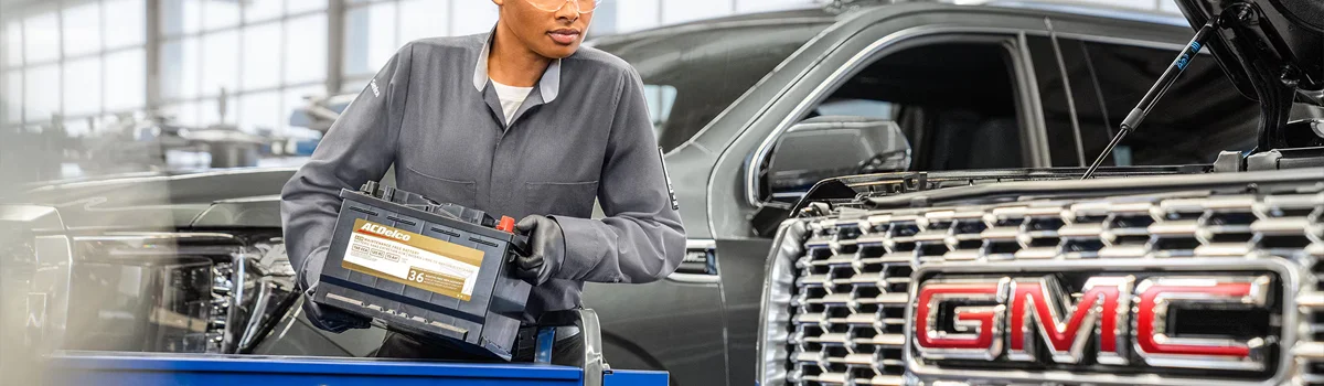 GMC Service tech working on vehicle