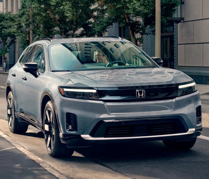 Honda Prologue Driving Down a city road