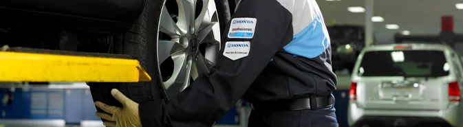 Honda Service Tech working on a car