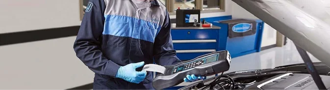 Honda Service Tech working on a car
