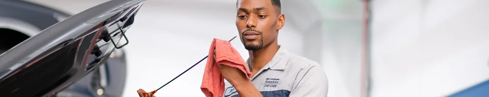 Hyundai Service Tech working on a car