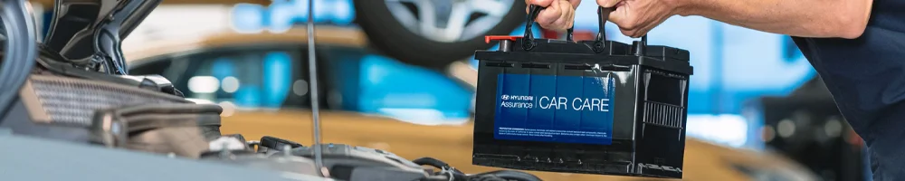 Hyundai Service Tech working on a car