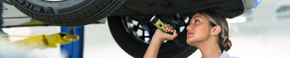 Hyundai Service Tech working on a car