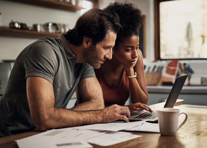 Couple looking at a laptop