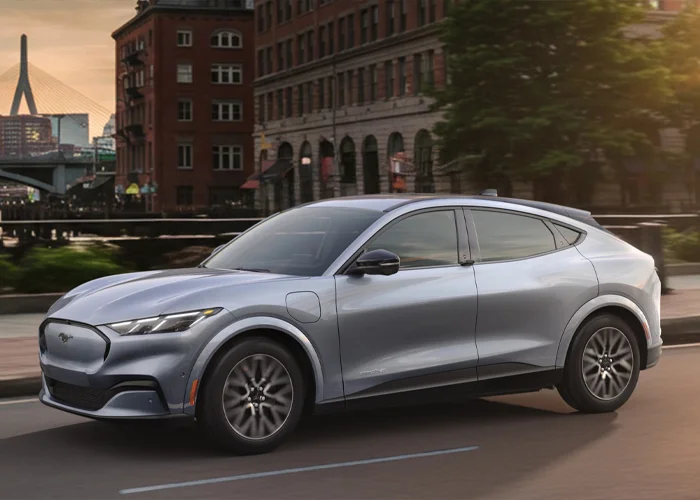 Ford Mustang Mach-E Driving Down Street